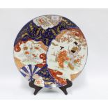 Imari charger decorated with figures in a landscape, 40cm diameter