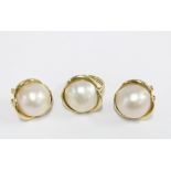 An 18ct gold pearl dress ring, stamped 750, together with matching earrings stamped 585 (3)