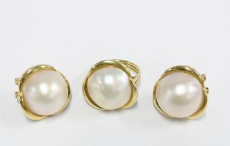 An 18ct gold pearl dress ring, stamped 750, together with matching earrings stamped 585 (3)