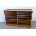 Late 19th / early 20th century light oak open bookcase with two bays and a plinth base, 116 x 184