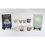A collection of 19th century tea and coffee cups together with two collectors books (9)