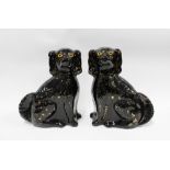 Pair of black glazed chimney spaniels, 31cm (2)