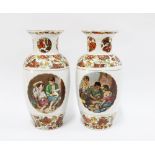 Pair of porcelain vases, transfer printed pattern of children eating fruit and playing dice, 26cm (