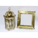 Heavy brass lantern style wall light with glazed panels and three internal candle style light