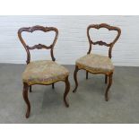 Pair of walnut balloon back side chairs with upholstered seats and cabriole legs. 86 x 40 x 42cm. (