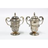 A novelty pair of Edwardian silver trophy shaped pepper pots, Sheffield 1904, 8cm high (2)