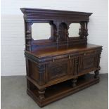 Late 19th century carved oak mirrorback sideboard, with frieze drawers and 'Green Man' motifs, on