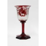 Bohemian ruby etched glass goblet with a stag and forest pattern, with facet stem and octagonal base