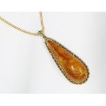 9ct gold chain with an amber pear shaped pendant, chain stamped 375