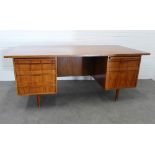 Mid century desk, rectangular top and drawers with each pedestal on teak brass capped legs,. 75 x