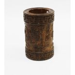 Carved brush pot, decorated in relief with dragons and calligraphy between Greek key borders, 15 x