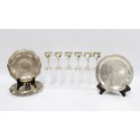 A pair of Eastern white metal dishes with engraved foliate pattern together with a white metal