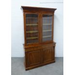 19th century mahogany bookcase cabinet, the moulded cornice above a pair of glazed doors opening