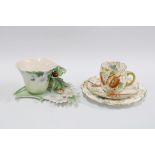 Franz porcelain cabinet cup and saucer and a continental porcelain cup, saucer and side plate