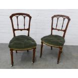 Pair of late 19th century Gothic style mahogany side chairs with green button upholstered seats.