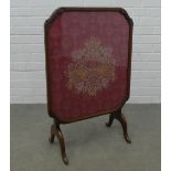 Mahogany tilt top table / screen, glazed with an embroidered insert, . 84 x 54cm.