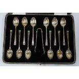 Cased set of twelve Art Deco silver coffee spoons and matching sugar tongs, Sheffield 1938