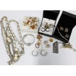 A collection of designer and costume jewellery to include a pair of Armani hoop earrings,