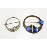 Silver penannular brooch, Glasgow 1947 and a similar brooch in copper with blue bosses (2)