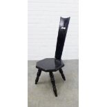 An ebonised spinning chair. 88 x 30 x 39cm.