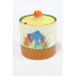 Clarice Cliff 'Bizarre' Crocus pattern cylindrical jam pot and cover, 10cm