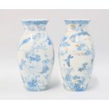 A pair of Japanese porcelain vases, square form with birds and foliage pattern with gilt highlights,