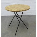 Folding table with circular wicker top and hairpin style legs. 54 x 50cm.