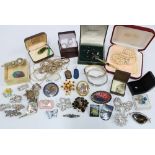 Silver brooches, two silver bangles, gold plated nephrite jade brooch and a collection of costume