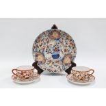 Imari scalloped dish and two Japanese porcelain cups and saucers (5) 22cm.