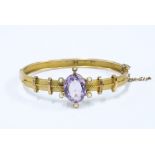 Victorian 9ct gold amethyst and seed pearl bangle, Birmingham 1893