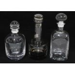 Three vintage glass decanters with stoppers to include one in smoked grey (3)