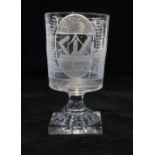 Masonic goblet glass, wheel engraved with Masonic emblems, on a square base, 16.5cm.