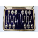 Cased set of twelve Epns teaspoons with matching sugar tongs