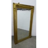 Large 19th century giltwood pier mirror with a rectangular plate encased within a bold column