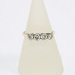 18ct gold and platinum diamond ring, claw set with four brilliant cut diamonds, size P