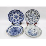 Four 18th century delft chargers (some damages) 35cm, (4)