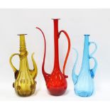 Three large coloured glass jugs with long stylised spouts, tallest 50cm (3)