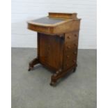 19th century rosewood Davenport, the writing slope with skiver enclosing a fitted interior, over