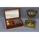 Early 20th century mahogany cased Jewel cleaning set, together with a bronze patinated basket
