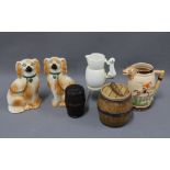 Early 20th century pottery to include a pair of chimney spaniels, hunting jug, tobacco jars, etc (6)