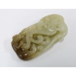 Carved jade plaque with a panther and scrolling foliage, 6 x 3cm