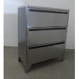 Industrial style polished steel chest with three long drawers and bracket feet, 113 x 92 x 46cm.