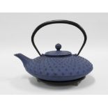 Japanese cast iron teapot, blue with dimpled body and separate circuitry stand (2) 22cm.