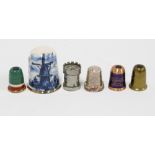 A silver paste set thimble, Birmingham 1992, three Stanhope type thimbles, another castellated