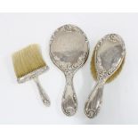 Sterling silver backed dressing table brush and mirror set together with a matching crumb brush (3)
