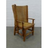 Small oak framed Orkney chair, curved back and arms and raised on square tapered legs united by