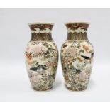 Pair of Japanese earthenware vases typically decorated with birds and chrysanthemums, each with