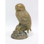 Bronze owl, modelled perched on a branch, apparently unsigned, 20cm high