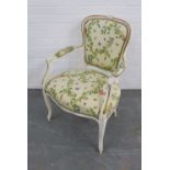 French style fauteuil chair, white painted and upholstered in a leaf and insect fabric, 86 x 59cm