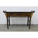 Chinese black lacquered altar style table with painted top and carved frieze with three drawers,